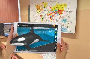 An interactive 3D model of an orca coming out of a tablet